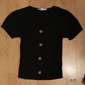 Black shirt with three buttons on front